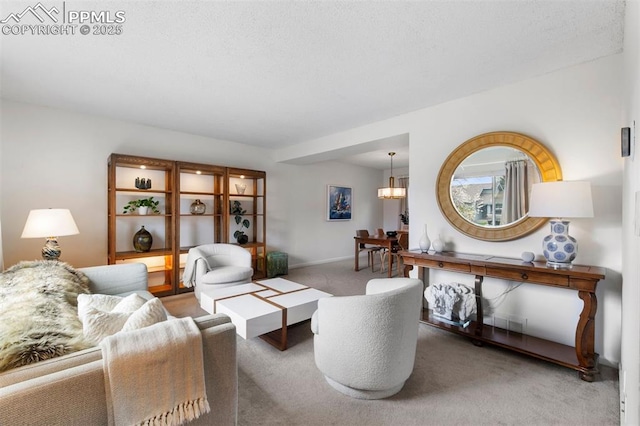 840 Quail Lake Cir, Colorado Springs, CO 80906 - carpeted living area featuring baseboards and a notable chandelier