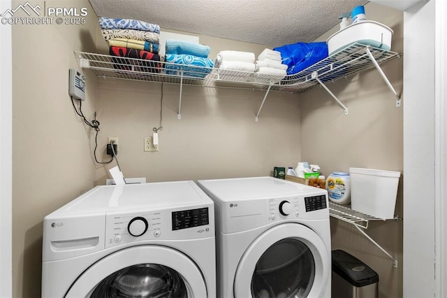 840 Quail Lake Cir, Colorado Springs, CO 80906 - washroom featuring a textured ceiling, washer and dryer, and laundry area