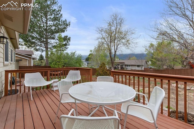 840 Quail Lake Cir, Colorado Springs, CO 80906 - deck featuring a fenced backyard and outdoor dining area