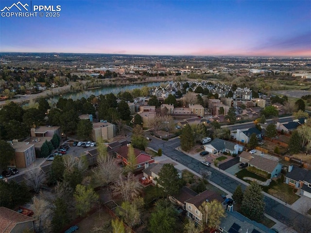 840 Quail Lake Cir, Colorado Springs, CO 80906 - aerial view at dusk with a residential view and a water view