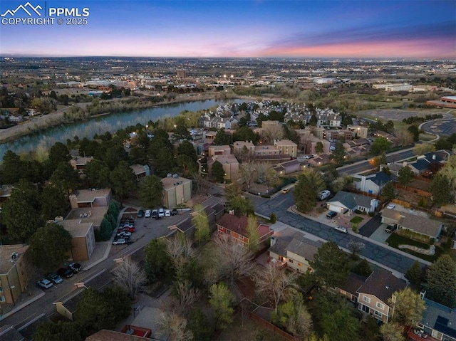 840 Quail Lake Cir, Colorado Springs, CO 80906 - aerial view at dusk featuring a water view and a residential view