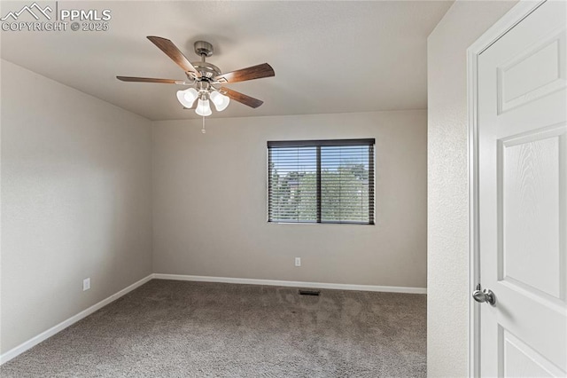 carpeted empty room featuring baseboards, a ceiling fan, and visible vents