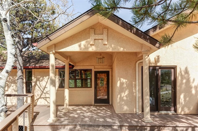 280 Highland Meadows Dr, Florissant, CO 80816 - doorway to property featuring a deck and stucco siding