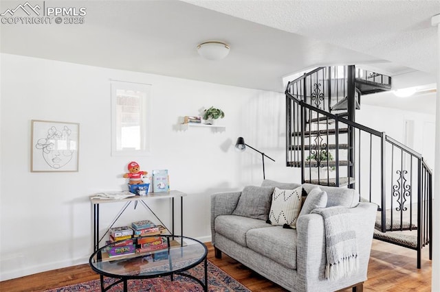 280 Highland Meadows Dr, Florissant, CO 80816 - living room featuring baseboards, wood finished floors, and stairs