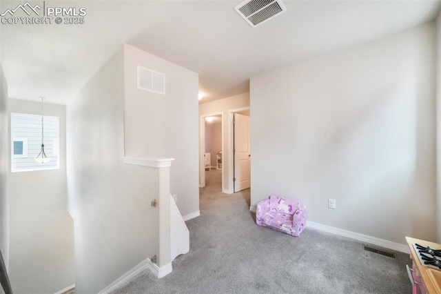 interior space featuring baseboards and visible vents
