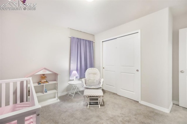 bedroom with carpet floors, baseboards, and a closet
