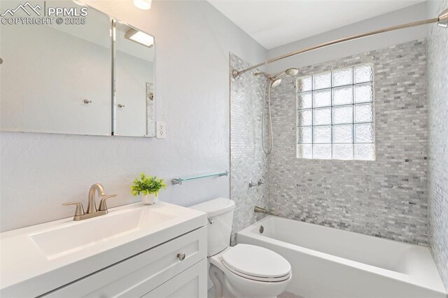 full bath with washtub / shower combination, vanity, and toilet