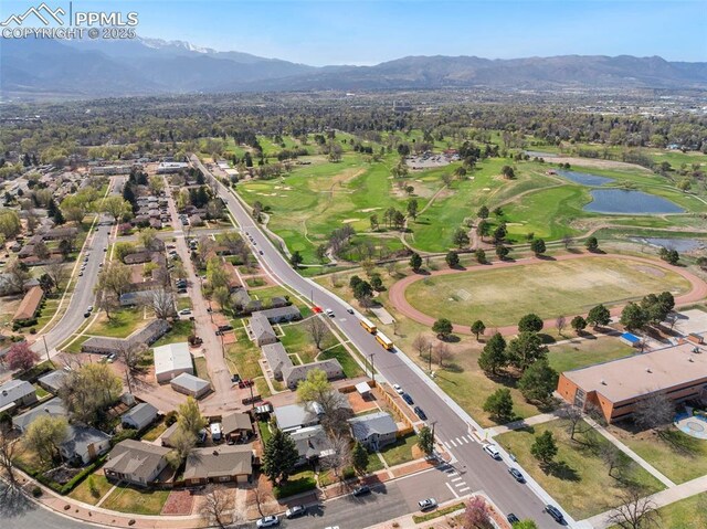 bird's eye view featuring a water and mountain view, a residential view, and golf course view
