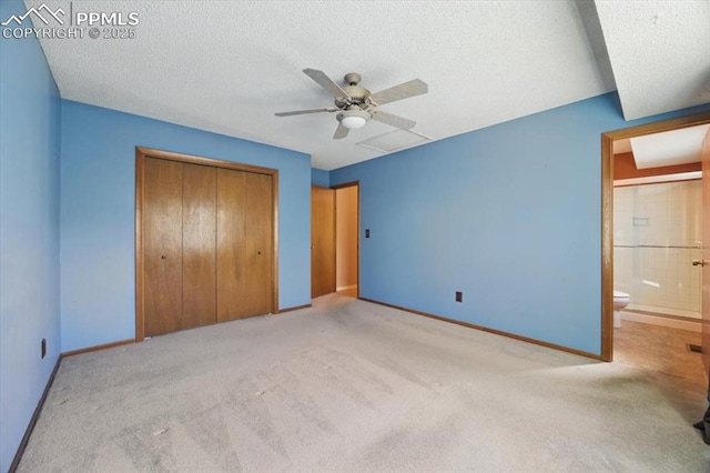 unfurnished bedroom with baseboards, carpet, and a closet