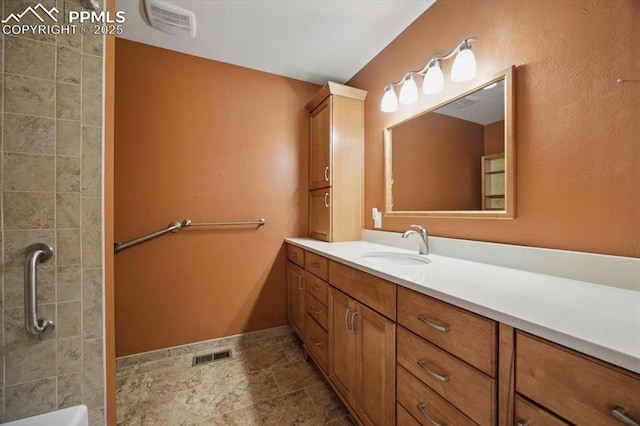 full bathroom with visible vents and vanity
