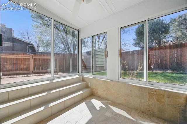 unfurnished sunroom featuring a healthy amount of sunlight