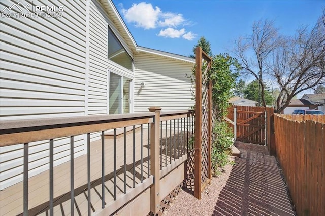 deck featuring fence and a gate