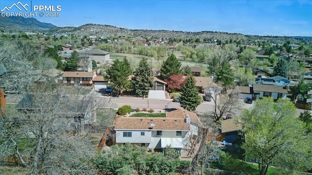 drone / aerial view with a residential view and a mountain view