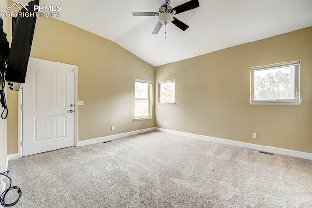 12590 Holmes Rd, Black Forest, CO 80908 - empty room featuring carpet floors, visible vents, baseboards, a ceiling fan, and vaulted ceiling