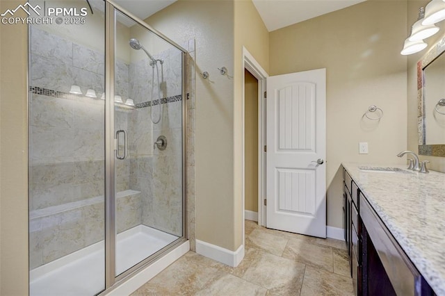 12590 Holmes Rd, Black Forest, CO 80908 - full bath featuring vanity, baseboards, and a shower stall