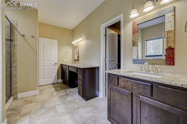12590 Holmes Rd, Black Forest, CO 80908 - full bathroom with baseboards, a sink, a stall shower, and two vanities
