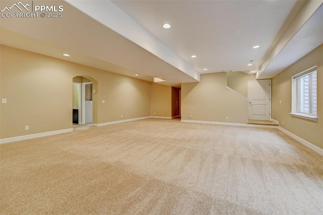 12590 Holmes Rd, Black Forest, CO 80908 - below grade area featuring recessed lighting, baseboards, light colored carpet, and arched walkways
