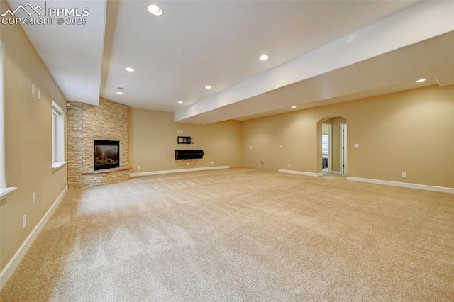 12590 Holmes Rd, Black Forest, CO 80908 - unfurnished living room featuring recessed lighting, baseboards, light colored carpet, and a fireplace