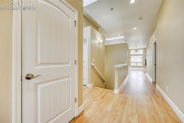 12590 Holmes Rd, Black Forest, CO 80908 - hall featuring recessed lighting, baseboards, an upstairs landing, wood finished floors, and visible vents
