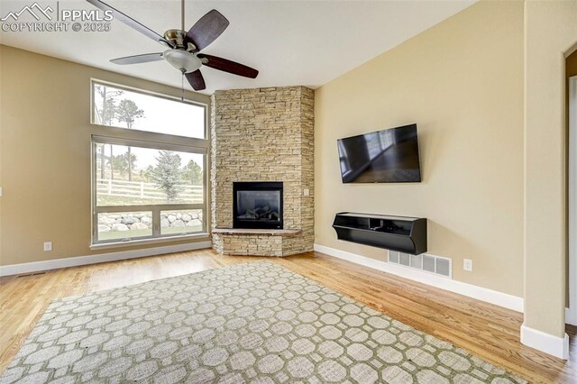 12590 Holmes Rd, Black Forest, CO 80908 - unfurnished living room featuring baseboards, ceiling fan, visible vents, and wood finished floors