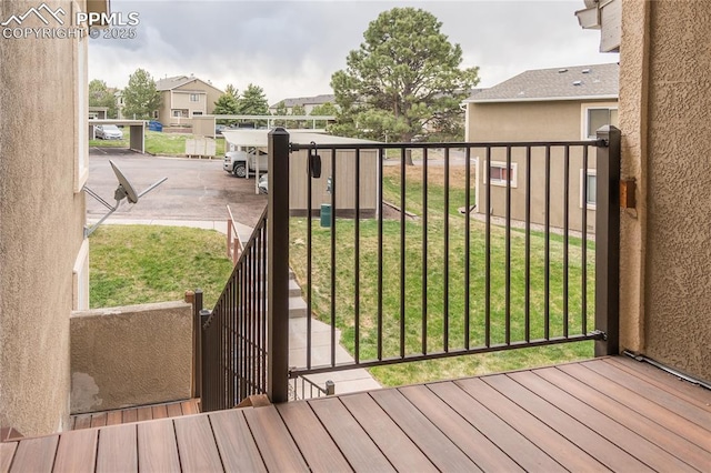 view of gate featuring a lawn