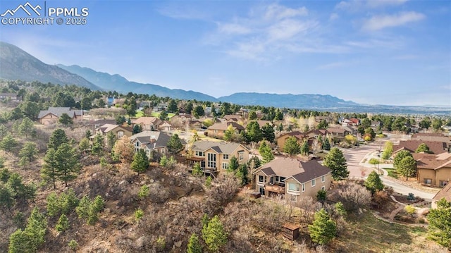 birds eye view of property with a residential view and a mountain view