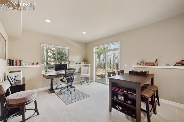 carpeted office space featuring baseboards, recessed lighting, and visible vents