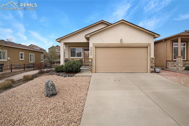 view of front facade featuring concrete driveway, stucco siding, stone siding, and fence