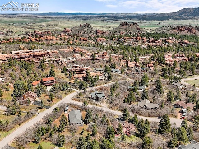 drone / aerial view featuring a mountain view