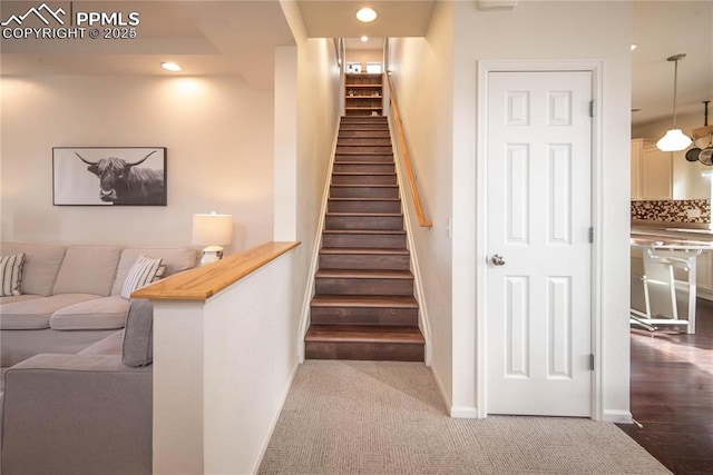 staircase featuring recessed lighting, carpet, and baseboards