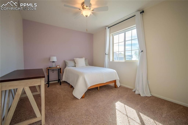 carpeted bedroom with a ceiling fan and baseboards