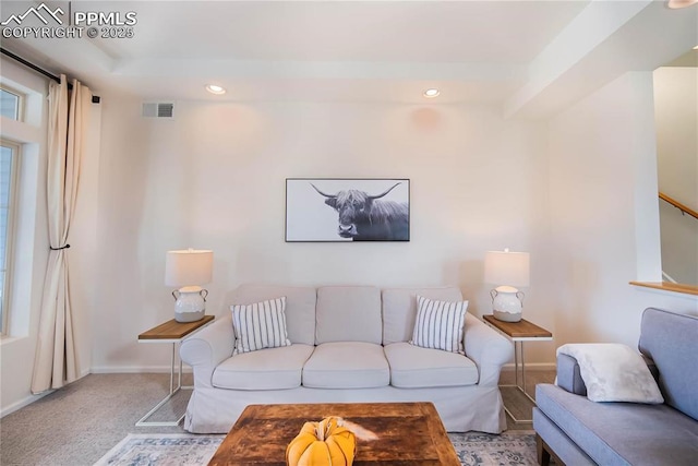 carpeted living room with visible vents, recessed lighting, and baseboards