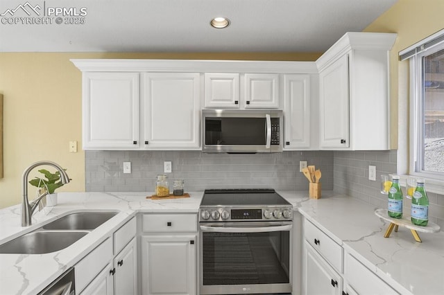 kitchen featuring a sink, white cabinetry, and appliances with stainless steel finishes