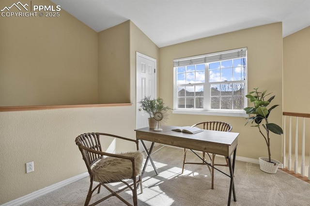 office area with vaulted ceiling, carpet floors, and baseboards