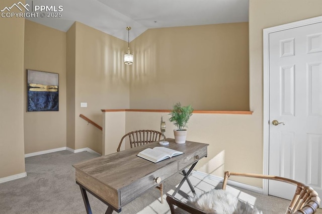 home office with carpet floors, vaulted ceiling, and baseboards