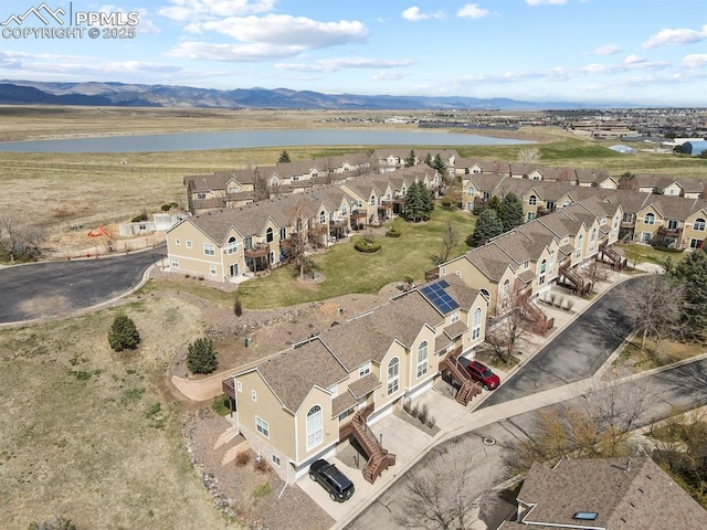 bird's eye view featuring a water and mountain view and a residential view