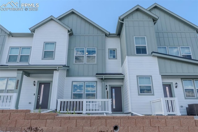 multi unit property with board and batten siding and central AC
