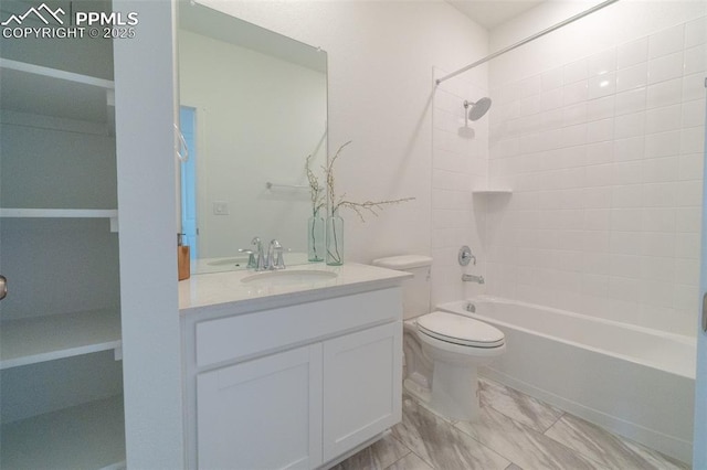 full bath featuring toilet, vanity, and bathtub / shower combination