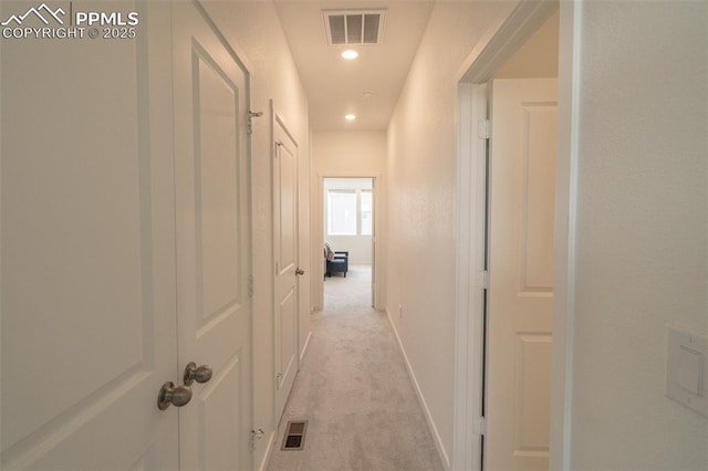 corridor featuring recessed lighting, visible vents, and light colored carpet