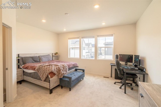 bedroom featuring recessed lighting, baseboards, and light colored carpet