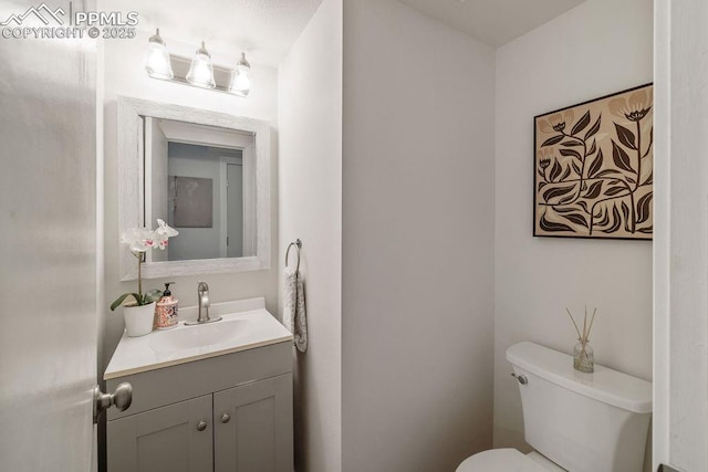 983 Moorings Dr, Colorado Springs, CO 80906 - half bathroom with toilet and vanity