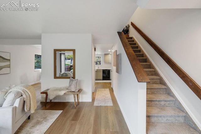 983 Moorings Dr, Colorado Springs, CO 80906 - staircase featuring wood finished floors