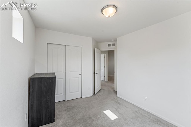 6117 Ashmore Ln, Colorado Springs, CO 80927 - unfurnished bedroom with baseboards, visible vents, a closet, and carpet