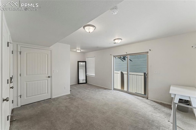 6117 Ashmore Ln, Colorado Springs, CO 80927 - interior space with baseboards, access to exterior, and carpet flooring