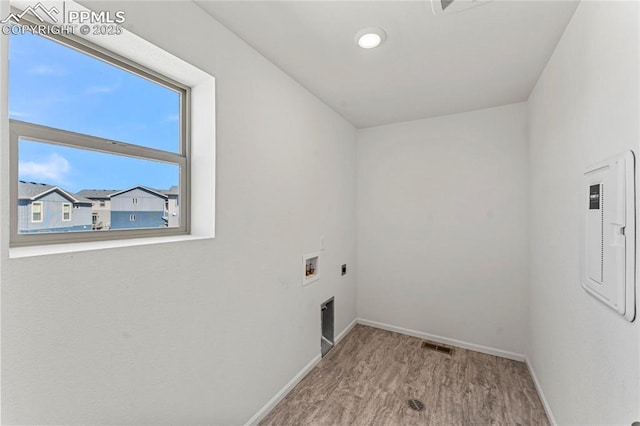 6117 Ashmore Ln, Colorado Springs, CO 80927 - washroom featuring electric dryer hookup, baseboards, hookup for a washing machine, wood finished floors, and laundry area