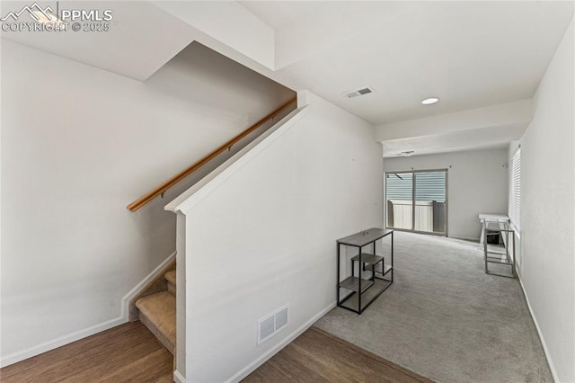 6117 Ashmore Ln, Colorado Springs, CO 80927 - stairs with wood finished floors, visible vents, and baseboards