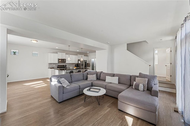 6117 Ashmore Ln, Colorado Springs, CO 80927 - living room with baseboards, recessed lighting, visible vents, and light wood-style floors