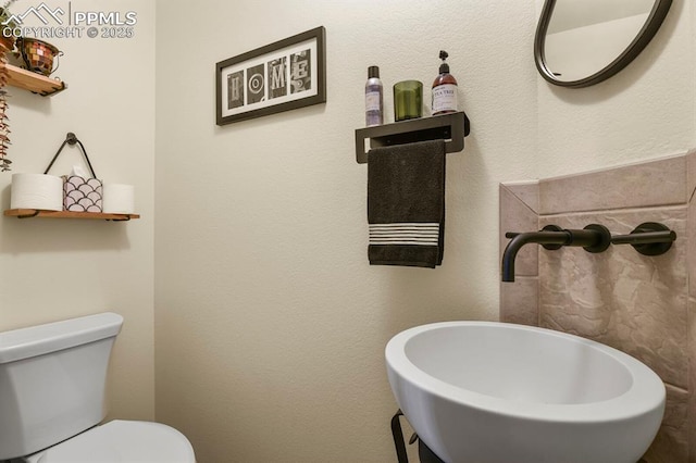 bathroom with a sink and toilet