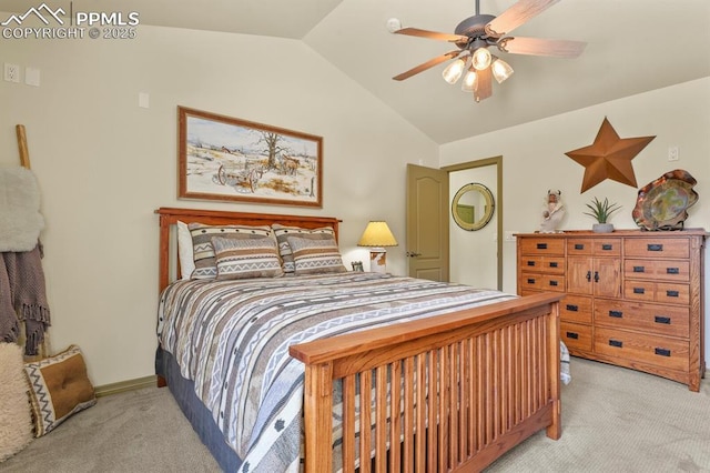 bedroom with ceiling fan, light carpet, and vaulted ceiling