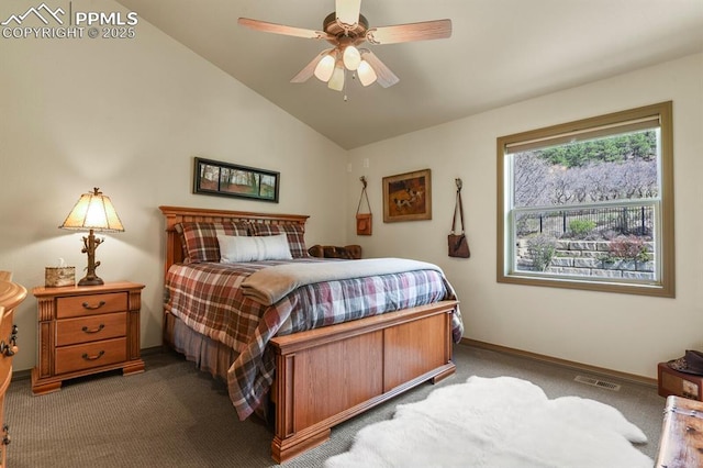 carpeted bedroom with baseboards, a ceiling fan, vaulted ceiling, and visible vents